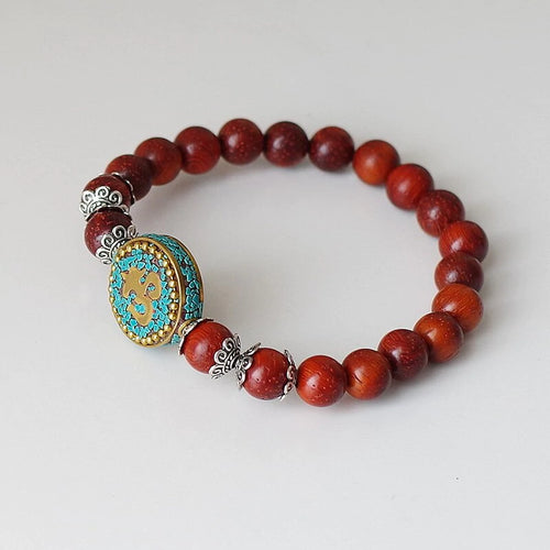 Bracelet Mala bouddhiste tibétain en perles de bois rouge symbole OM