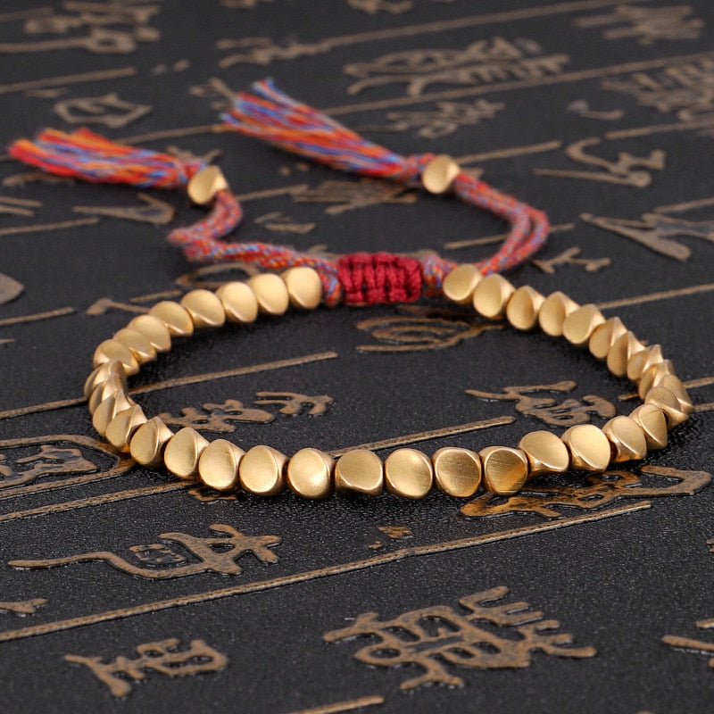 Bracelet tibétain en perles de cuivre, tressé à la main