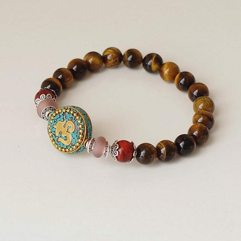 Bracelet Mala bouddhiste tibétain avec perles d'Oeil de Tigre - symbole OM